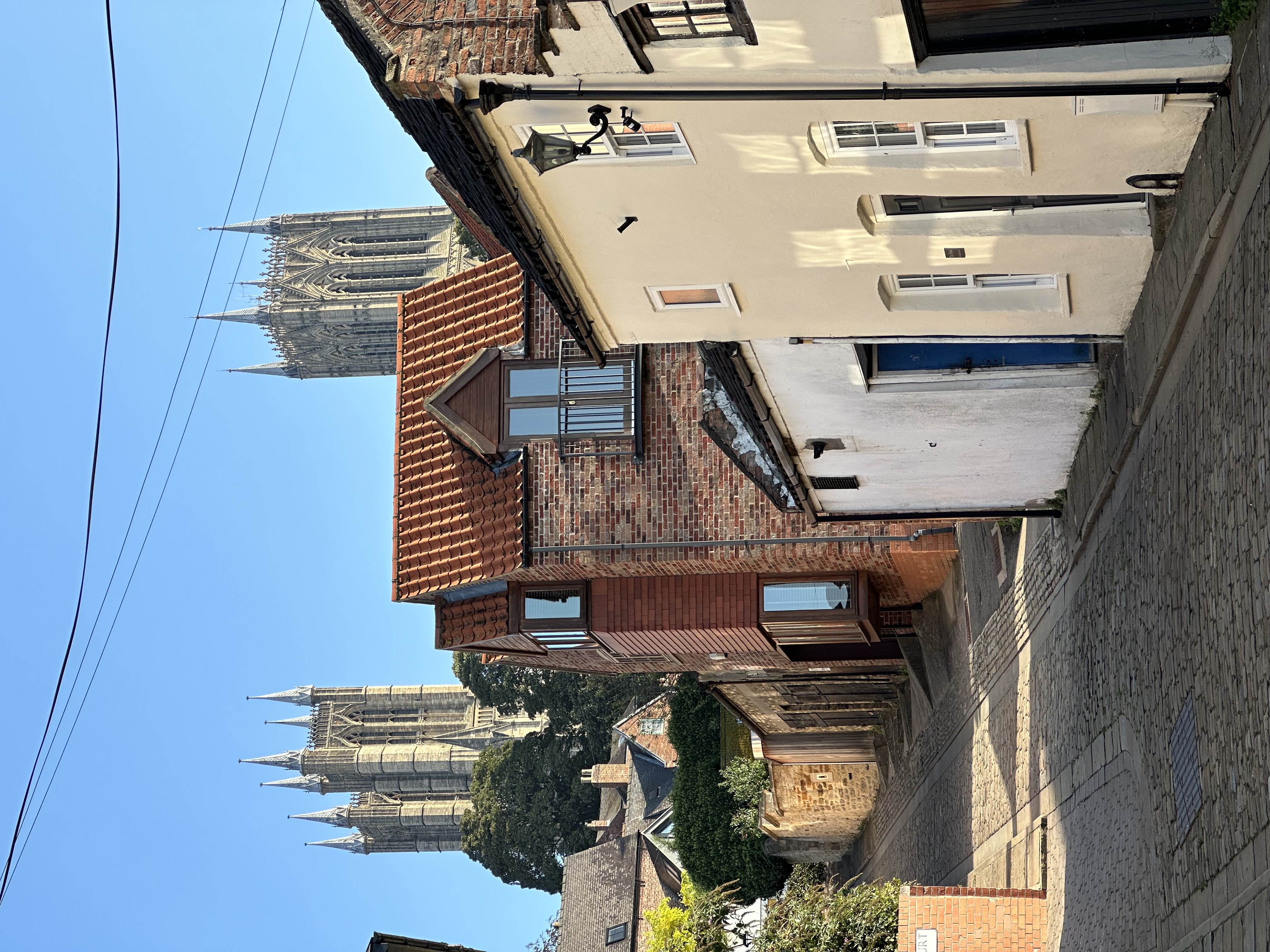 The Nook on a Lincoln street with the cathedral towers beyond